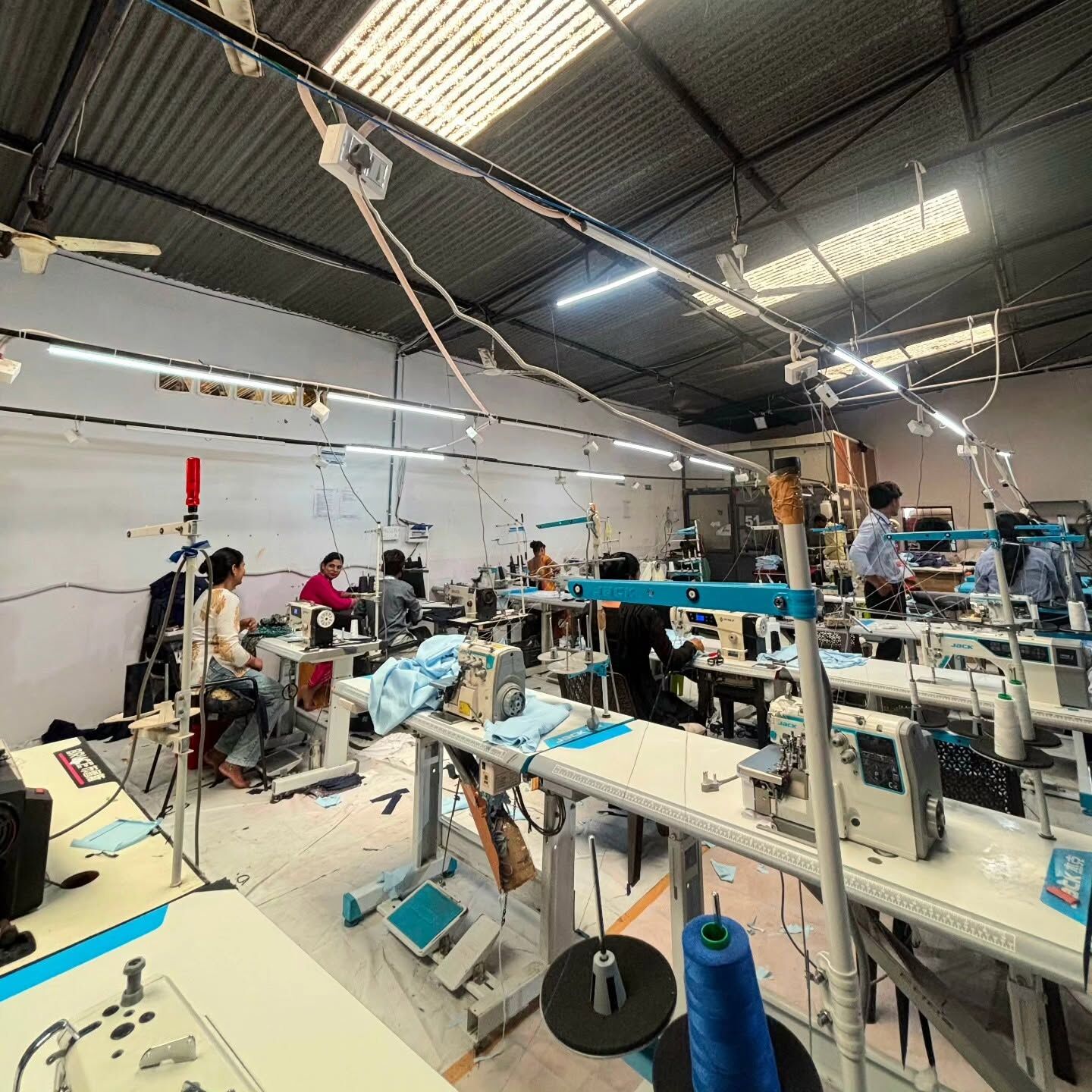 Rows of machines on the stitching floor of the Kamio unit.
