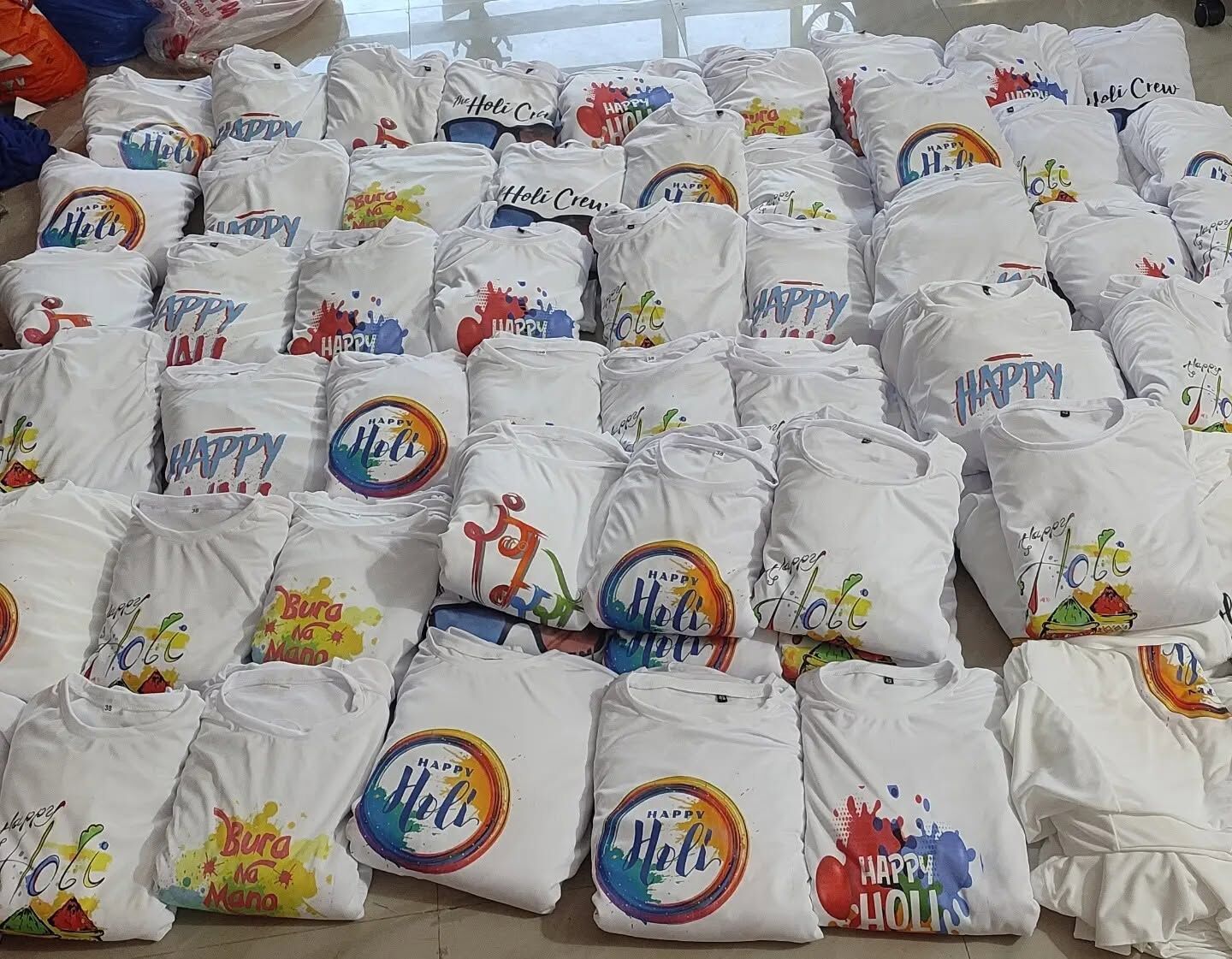 Holi t-shirts, printed and packed for delivery.